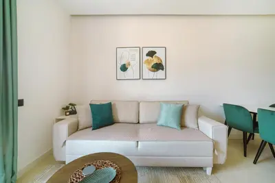 a living room with a couch and a table at ZOA Seaview Apartment in Becici