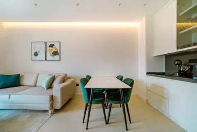 a living room with a couch and a table at ZOA Seaview Apartment in Becici