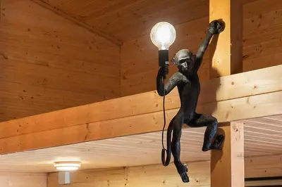 a light hanging from the ceiling of a room at River Breeze in Ulcinj