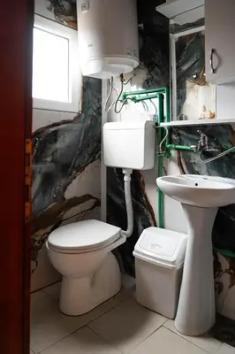 a bathroom with a toilet and a sink at River Breeze in Ulcinj