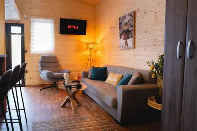 a living room with a couch and a chair at River Breeze in Ulcinj