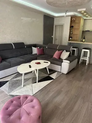 a living room with a couch and a table at Apartman Vuk in Budva