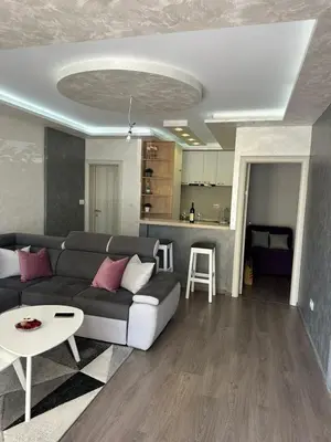 a living room with a couch and a table at Apartman Vuk in Budva