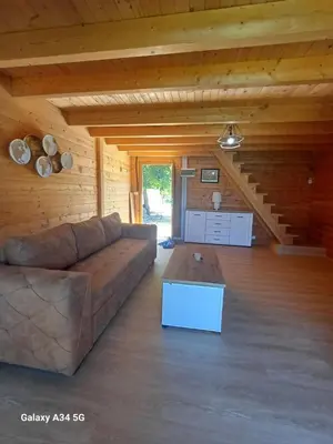 a living room with a couch and a table at Mimas HOUSE ADA BOJANA in Ulcinj