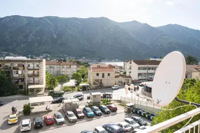 a view of a parking lot with cars parked at Central Apartment Dobrota II in Kotor