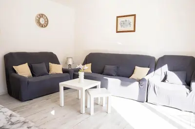 a living room with two couches and a table at Central Apartment Dobrota II in Kotor