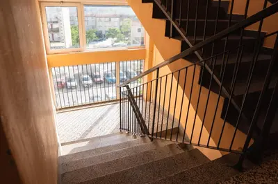 a stairway with a window and a stair railing at Central Apartment Dobrota II in Kotor