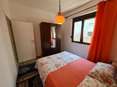 a bedroom with a bed and a window at Stefanelo in Ulcinj