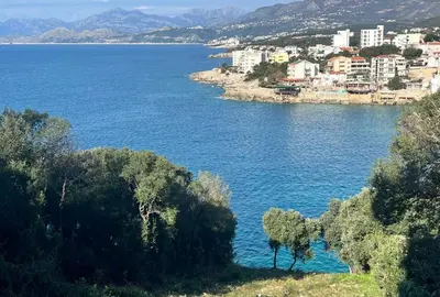 a view of a large body of water with buildings at Hladna Uvala Apartment - 2 bedroom in Bar