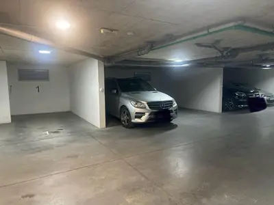 a parking garage with a car parked in it at Dagana in Budva