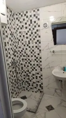 a bathroom with a toilet and a sink at Apartments Nera in Utjeha