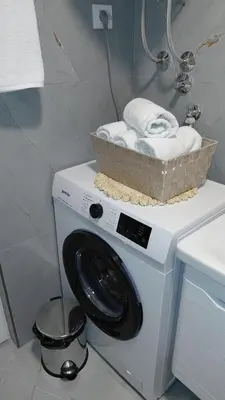 a washing machine with a basket on top of it at Apartman Vuk 15 in Budva