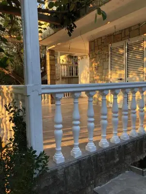 a white railing on a porch of a house at Apartments Lipa in Budva