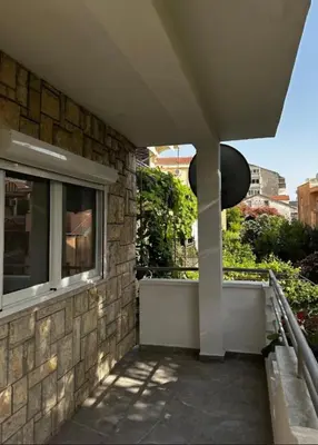 a balcony of a building with a window at Apartments Lipa in Budva