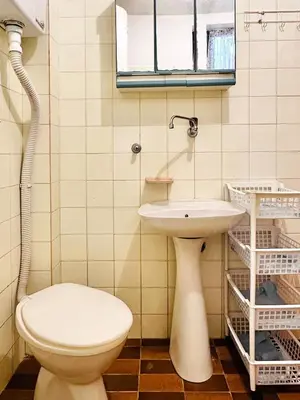 a bathroom with a toilet and a sink at Princess of the Beach in Sutomore