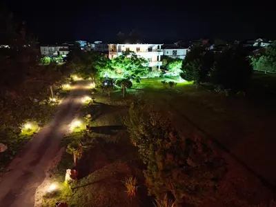 an image of a street at night with lights at Antonios Apartments in Ulcinj