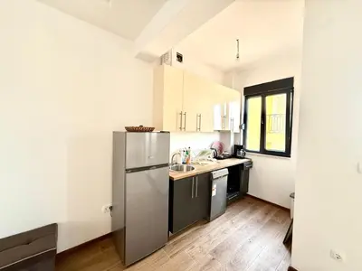 a kitchen with a refrigerator and a sink at Veliki Pijesak One Bedroom Apartment in Dobra Voda