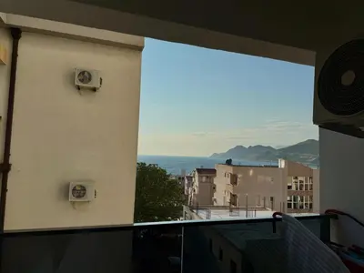 a view of the ocean from a balcony at Veliki Pijesak One Bedroom Apartment in Dobra Voda
