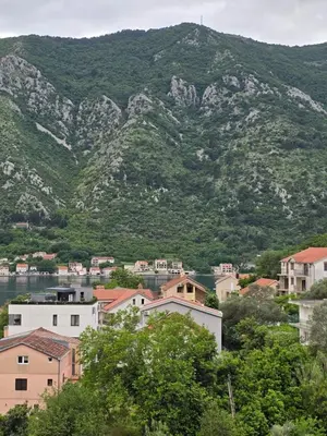 a town in front of a mountain at Apartman Milunović in Dobrota