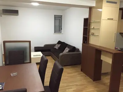 a living room with a couch and a table at Andreja Apartment in Budva