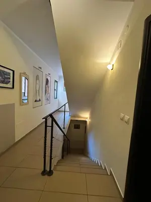 a hallway with a staircase in a building at Bono Apartments in Budva
