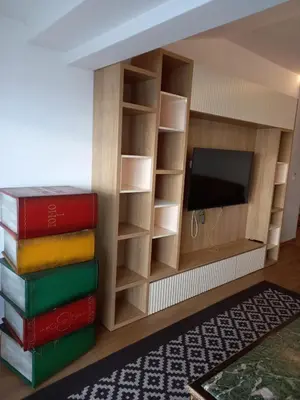 a room with books and a flat screen tv at Apartman Borka Rezevici in Krstac