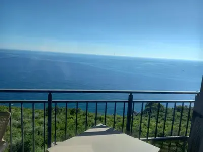 a view of the ocean from a balcony at Apartman Borka Rezevici in Krstac