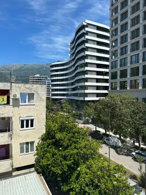 a view of two tall buildings in a city at Apartment Mediteraneo in Budva