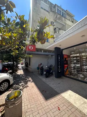 a building with a motorcycle parked in front of it at Apartment Mediteraneo in Budva