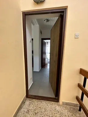 a doorway into a hallway with a mirror at Apartment Mediteraneo in Budva