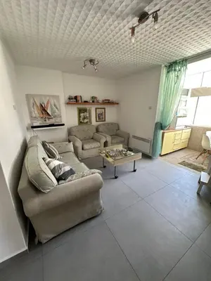 a living room with a couch and a table at Apartment Mediteraneo in Budva