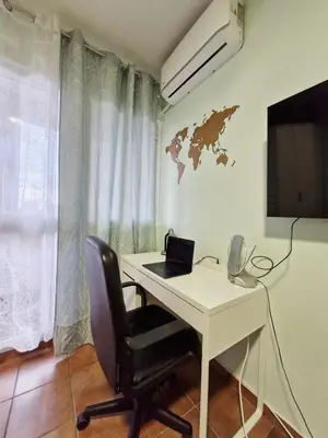 a room with a desk with a laptop on it at Ilino Studio Apartment in Bar