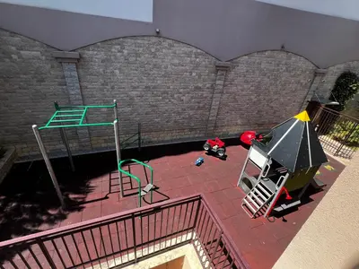 an aerial view of a playground in a building at Apartment Zevs Bečići in Kravlja