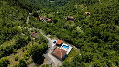 an aerial view of a house in a forest at Wild silence - Skadar Lake in Virpazar