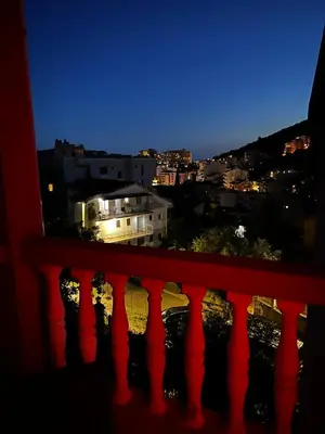 a view of a city from a balcony at night at Villa Linna in Budva