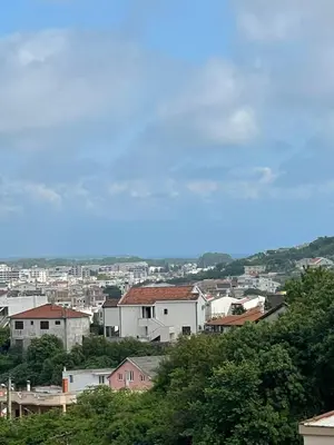 a view of a city with buildings on a hill at Cool room in Authentic Montenegro House in Ulcinj