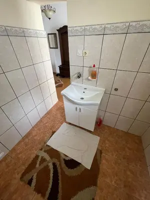 a bathroom with a white sink and a mirror at Cool room in Authentic Montenegro House in Ulcinj
