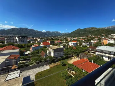 a view of a city with mountains in the background at Studio 89 in Burtaiši