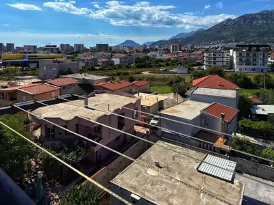 an aerial view of a city with buildings and mountains at Studio 89 in Burtaiši