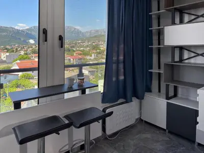 a room with a table and a window with a view at Studio 89 in Burtaiši