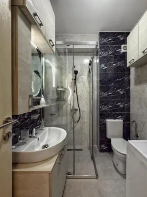 a bathroom with a sink and a shower and a toilet at Studio 89 in Burtaiši