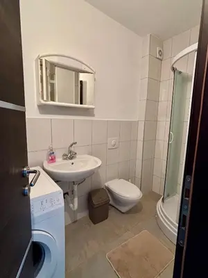 a bathroom with a sink toilet and a mirror at Lotus in Donji Štoj