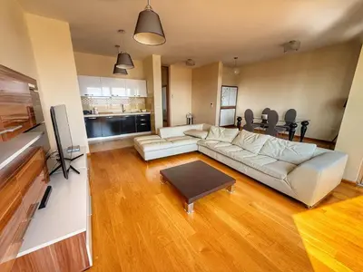a living room with a couch and a table at Jelena apart Budva in Becici