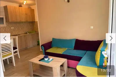a living room with a couch and a table at Apartmani Lucija Sutomore in Sutomore