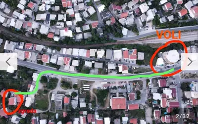 a site map of a neighborhood with a yellow circle and houses at Apartmani Lucija Sutomore in Sutomore