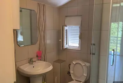 a bathroom with a toilet and a sink at Apartmani Lucija Sutomore in Sutomore
