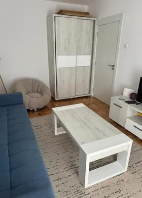 a living room with a couch and a coffee table at The View Apartment in Budva