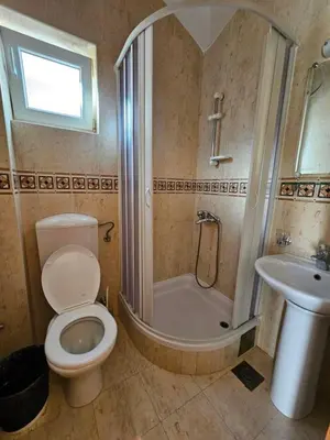 a bathroom with a toilet and a shower and a sink at Apartments Premier in Budva