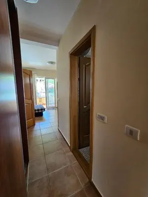a hallway with an open door to a room at Apartments Premier in Budva