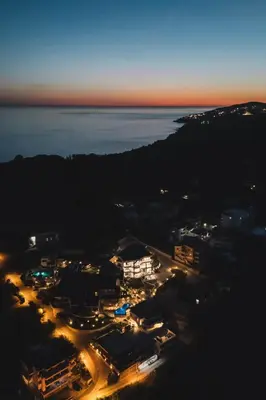 an aerial view of a city at night at Azanti Residence in Ulcinj